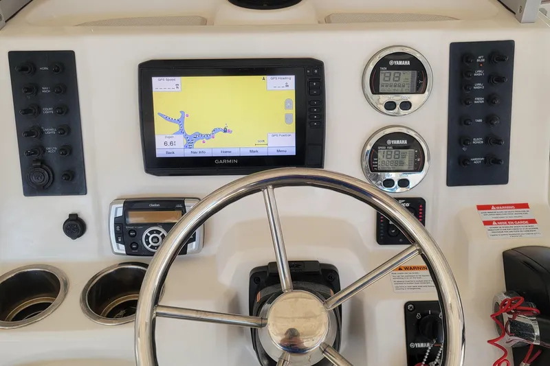 Slide: The Image of 2018 Robalo R222 Center Console dashboard with Garmin GPS and Yamaha gauges. - 8