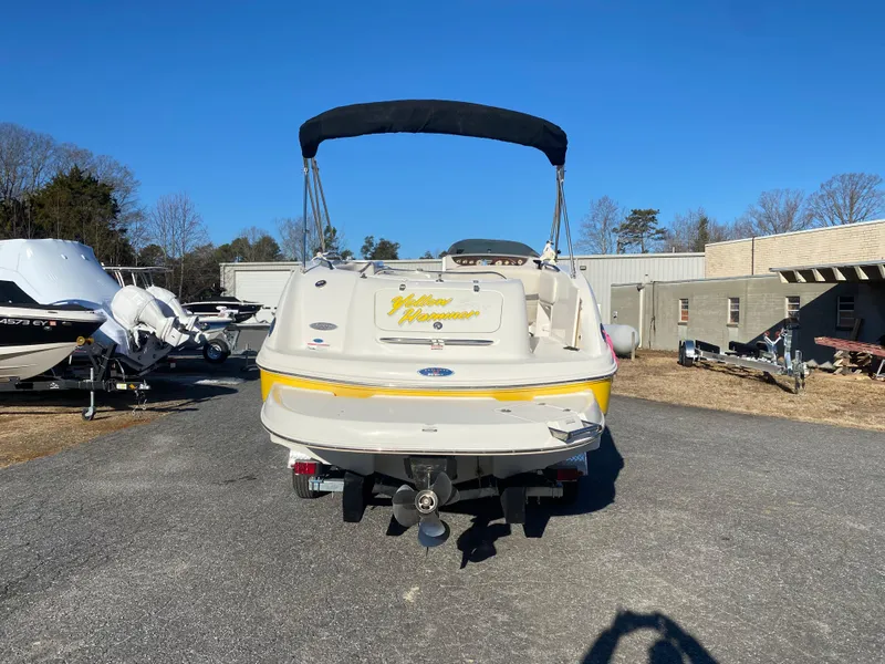 Slide: The Image of 2006 Chaparral Sunesta 252 boat, rear view, parked outdoors on a sunny day. - 2