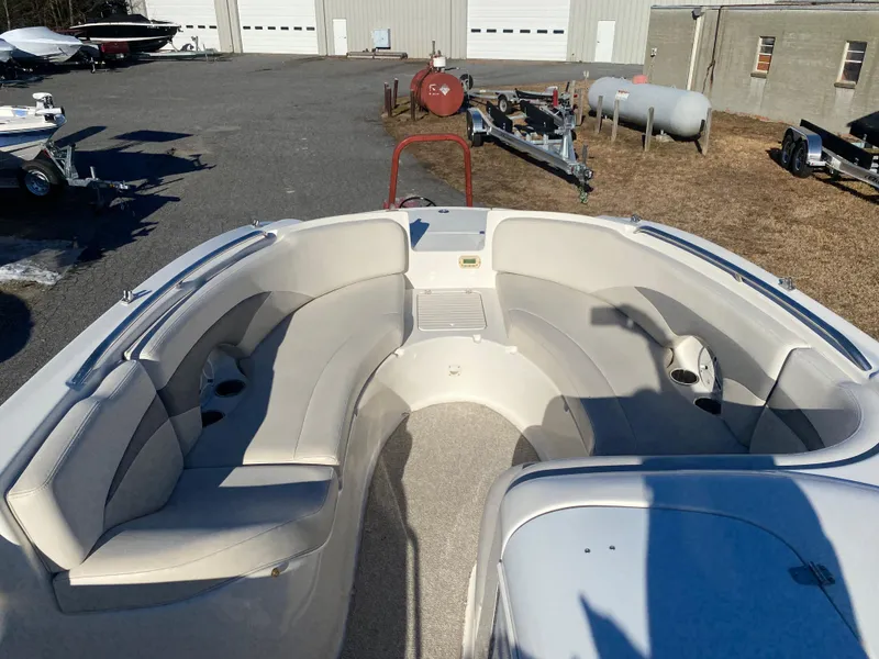 Slide: The Image of 2006 Chaparral Sunesta 252 boat interior with spacious seating and storage compartments. - 3