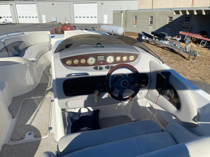 Slide: The Image of 2006 Chaparral Sunesta 252 boat interior with steering wheel and dashboard controls. - 6