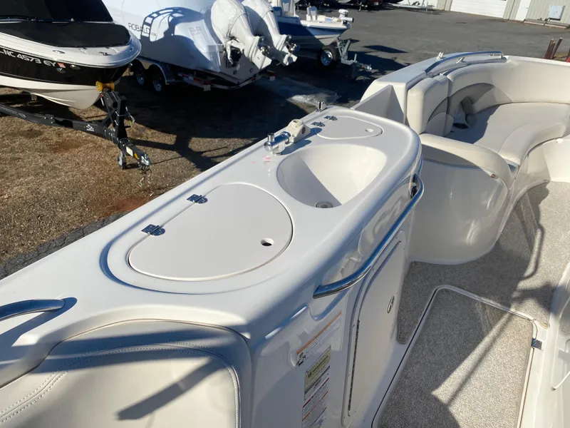 Slide: The Image of 2006 Chaparral Sunesta 252 boat interior with sink and seating area. - 8