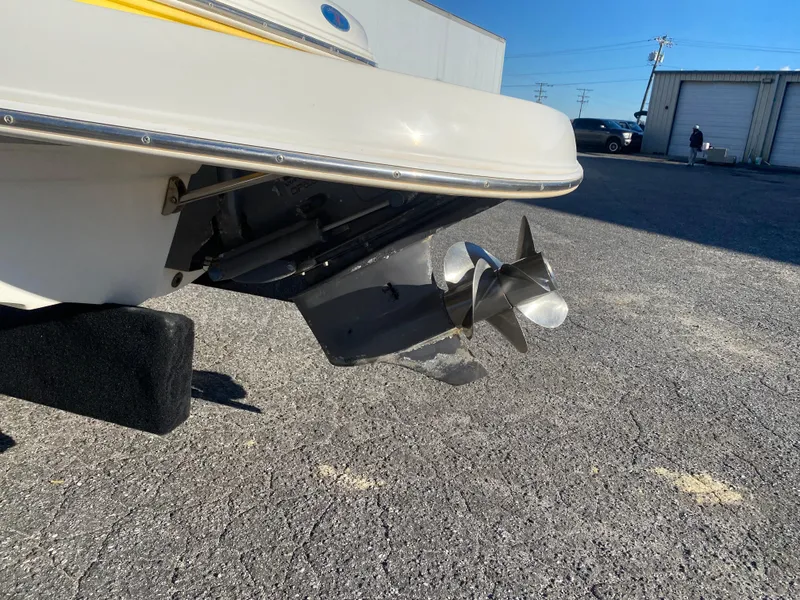 Slide: The Image of 2006 Chaparral Sunesta 252 boat propeller and stern in a parking lot. - 9