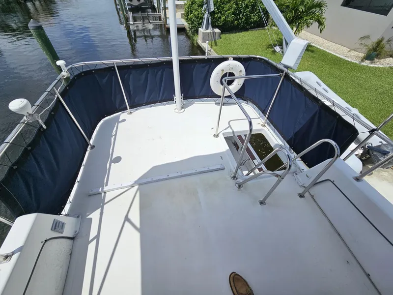 Slide: The Image of 1981 Mainship 34 Trawler deck with railing and water view. - 17