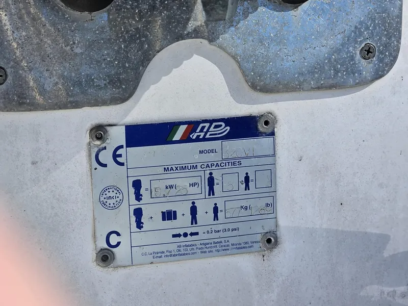 Slide: The Image of Plaque displaying maximum capacities on a 1981 Mainship 34 Trawler boat. - 44