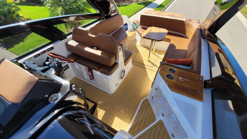 Slide: The Image of 2023 NX Boats NX340 interior with luxurious seating and modern design. - 9