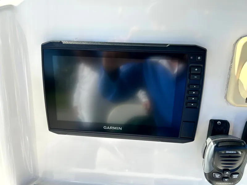 Slide: The Image of Garmin display on 2003 Pursuit 2470 Center Console boat dashboard. - 13