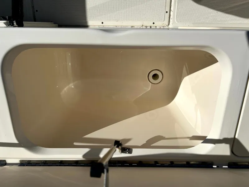 Slide: The Image of Livewell compartment on a 2003 Pursuit 2470 Center Console boat. - 20