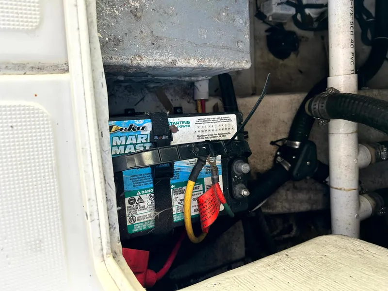 Slide: The Image of Marine battery installation in a 2003 Pursuit 2470 Center Console boat. - 23
