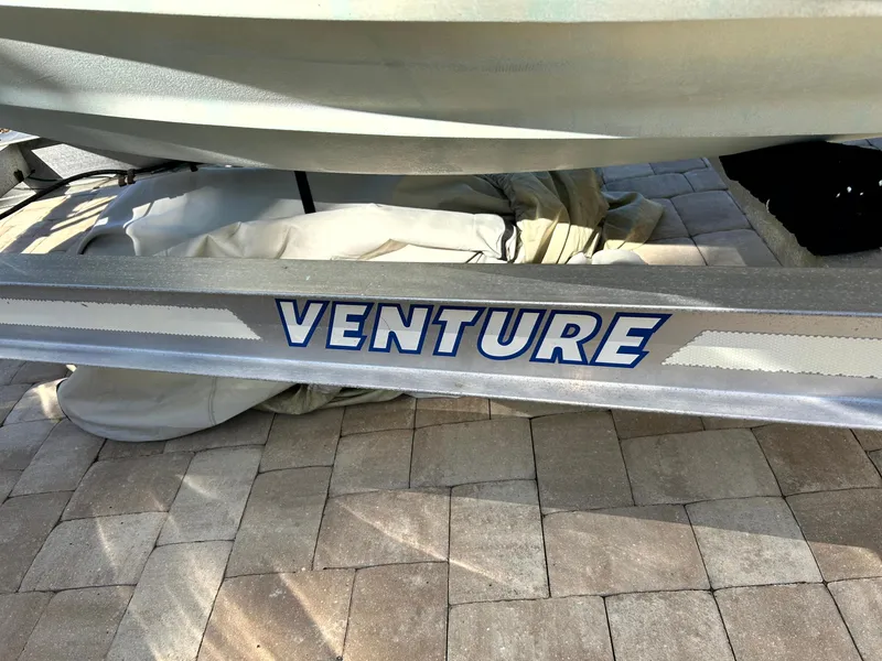Slide: The Image of Trailer for 2003 Pursuit 2470 Center Console boat, labeled "Venture." - 29