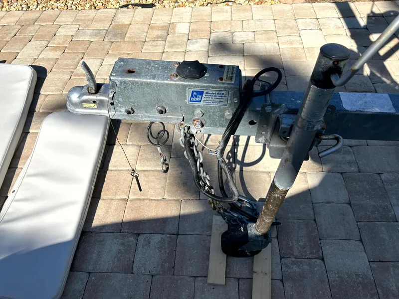 Slide: The Image of Trailer hitch mechanism on a 2003 Pursuit 2470 Center Console boat. - 31