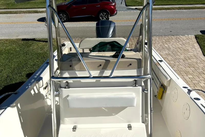 Slide: The Image of 2003 Pursuit 2470 Center Console boat interior with stainless steel frame and seating. - 36
