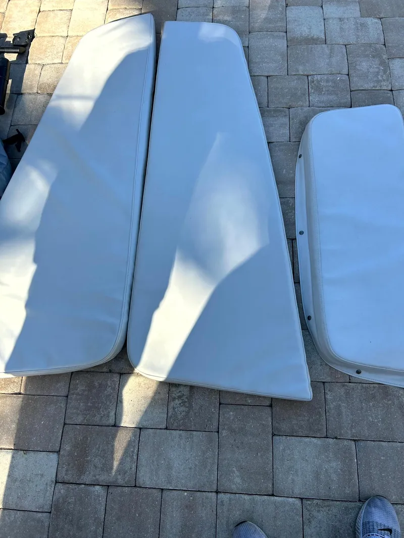 Slide: The Image of Cushions for 2003 Pursuit 2470 Center Console boat on tiled surface. - 5