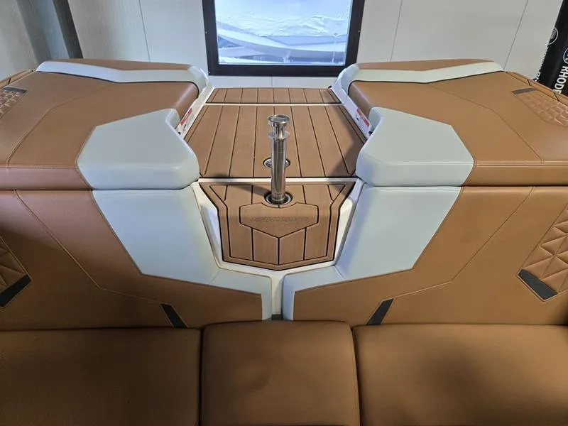 Slide: The Image of 2023 Nautique Super Air Nautique GS20 interior with tan and white seating. - 16