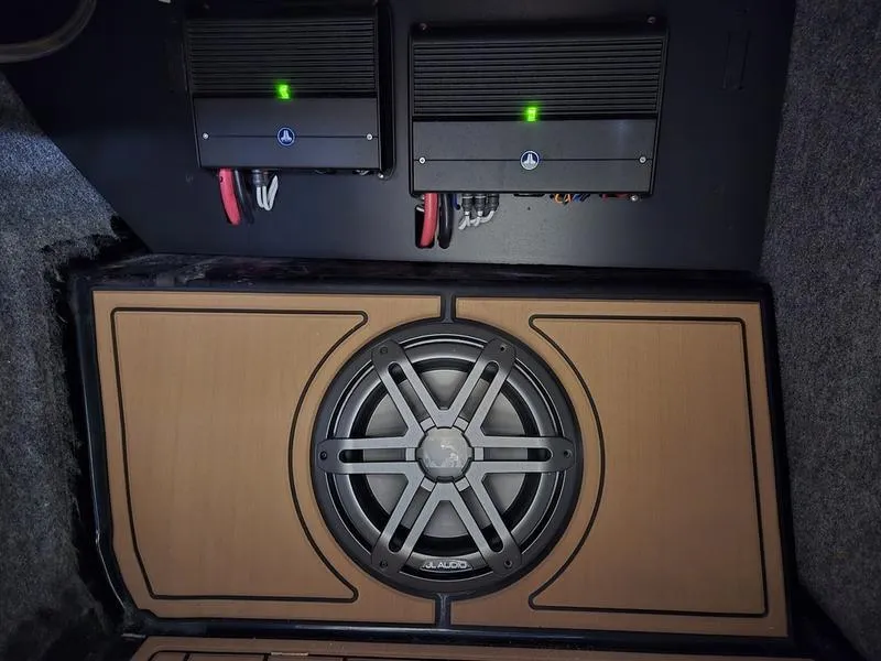 Slide: The Image of 2023 Nautique Super Air Nautique GS20 audio system with subwoofer and amplifiers. - 24