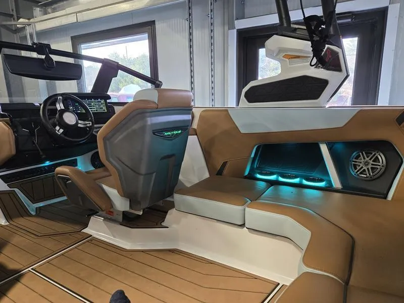 Slide: The Image of 2023 Nautique Super Air Nautique GS20 interior with modern design and ambient lighting. - 9
