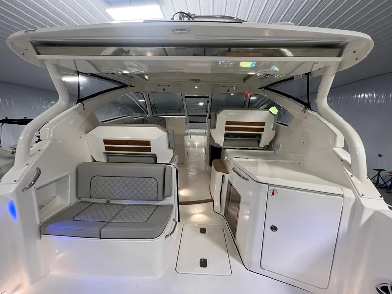 Slide: The Image of 2026 Pursuit DC 365 Dual Console interior, featuring seating and modern amenities in a sleek design. - 15