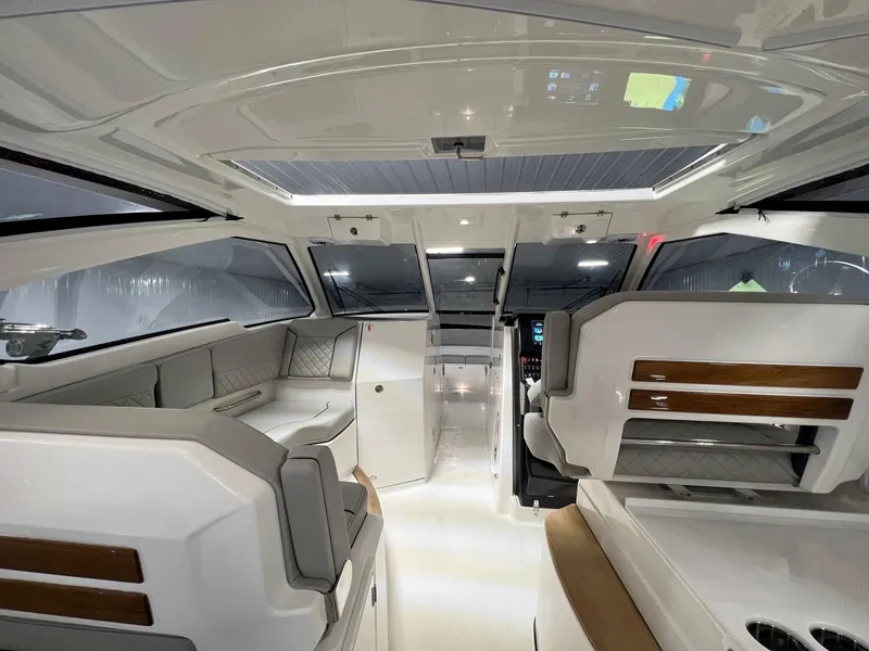 Slide: The Image of 2026 Pursuit DC 365 Dual Console interior, featuring modern design and spacious seating. - 25