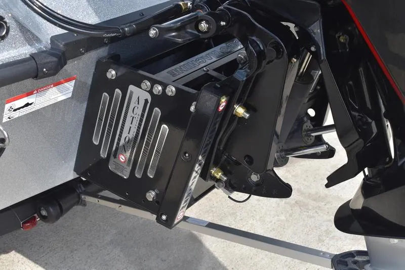 Slide: The Image of 2025 Triton 21XP Patriot boat with powerful black and red outboard motor. - 11