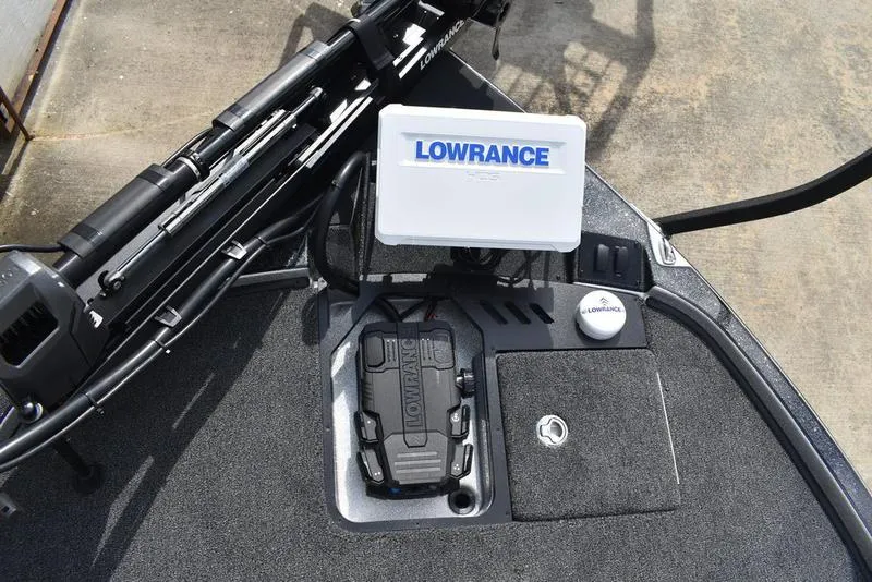 Slide: The Image of 2025 Triton 21XP Patriot boat dashboard with Lowrance electronics and advanced navigation system. - 13