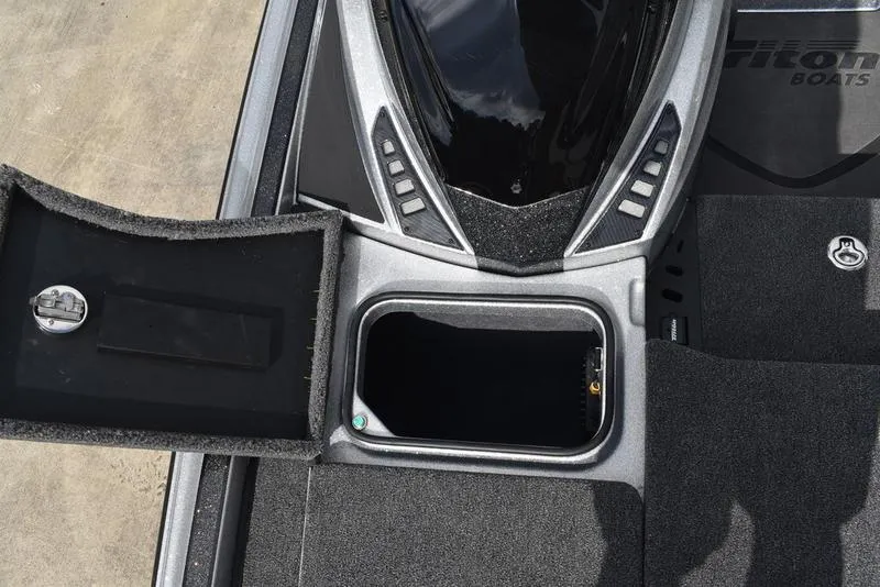 Slide: The Image of 2025 Triton 21XP Patriot boat storage compartments with open hatch and sleek design. - 21