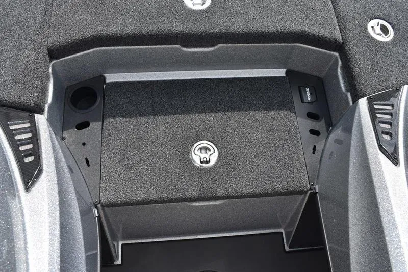 Slide: The Image of 2025 Triton 21XP Patriot boat storage compartment with secure lock and sleek design. - 22