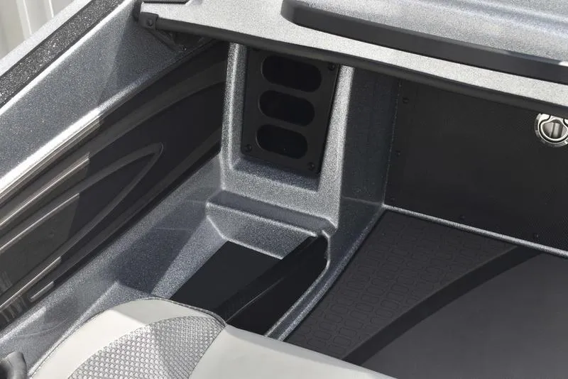 Slide: The Image of Interior view of 2025 Triton 21XP Patriot boat, showcasing sleek design and storage compartments. - 26