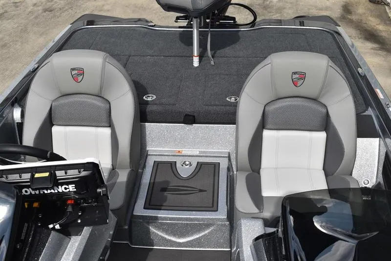 Slide: The Image of 2025 Triton 21XP Patriot boat interior with two gray seats and a control panel. - 31