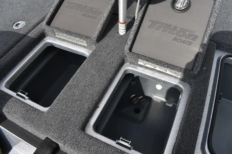 Slide: The Image of 2025 Triton 21XP Patriot boat storage compartments with open lids, showcasing interior space. - 35
