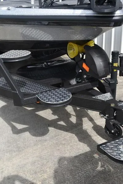 Slide: The Image of 2025 Triton 21XP Patriot boat ladder on concrete surface. - 6