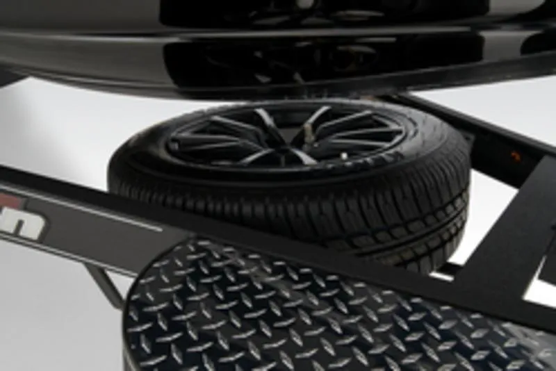 Slide: The Image of 2025 Triton 21XP Patriot boat with powerful outboard motor, sleek black and red design. - 7