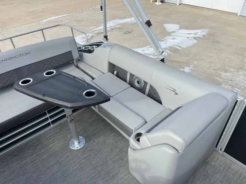 Slide: The Image of 2021 Bennington L 21 Swingback pontoon boat interior with seating and table. - 19