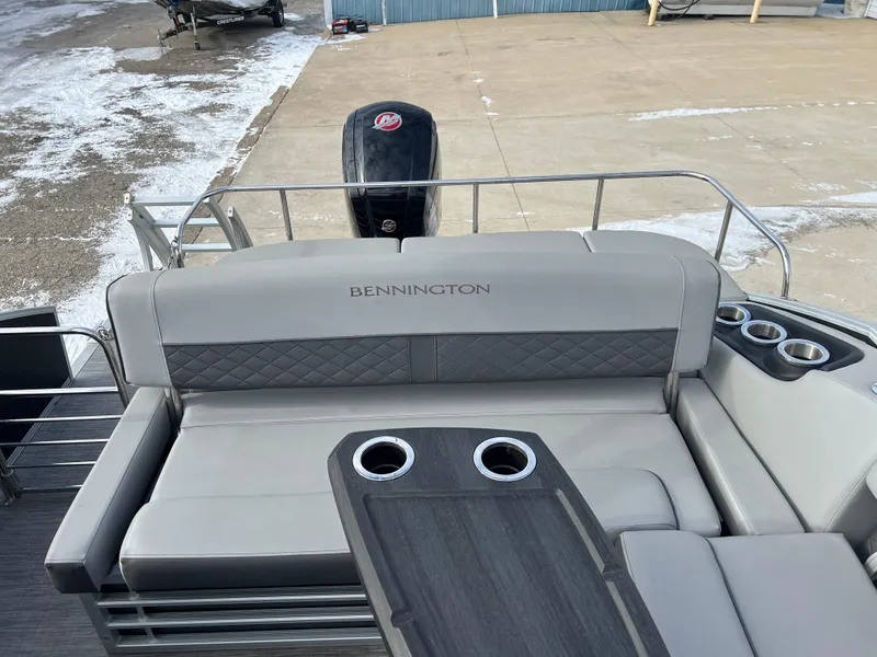 Slide: The Image of 2021 Bennington L 21 Swingback boat with cushioned seating and cup holders. - 22