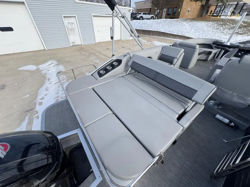 Slide: The Image of 2021 Bennington L 21 Swingback boat with gray seating and modern design. - 23