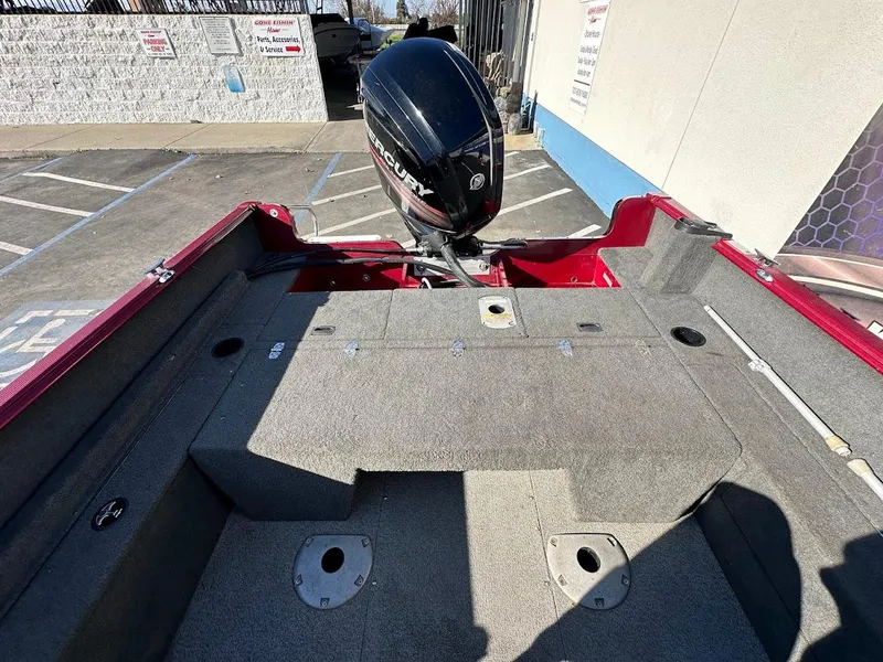 Slide: The Image of 2015 Lund 1750 Rebel XS SS boat interior with Mercury outboard motor. - 16