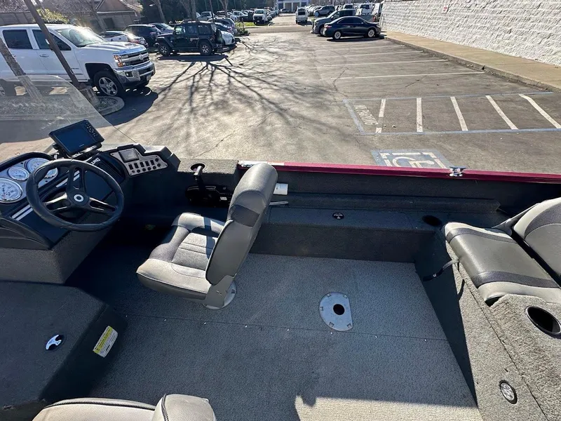 Slide: The Image of 2015 Lund 1750 Rebel XS SS boat interior in a parking lot. - 18