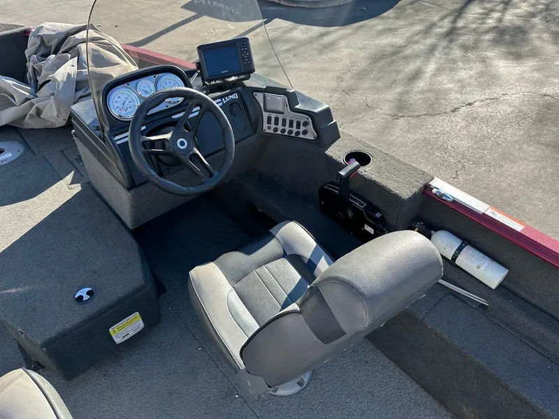 Slide: The Image of 2015 Lund 1750 Rebel XS SS boat interior with steering wheel and dashboard. - 19