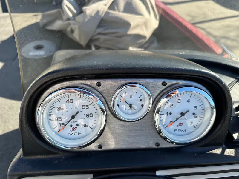 Slide: The Image of Dashboard of a 2015 Lund 1750 Rebel XS SS boat showing speedometer and RPM gauges. - 22