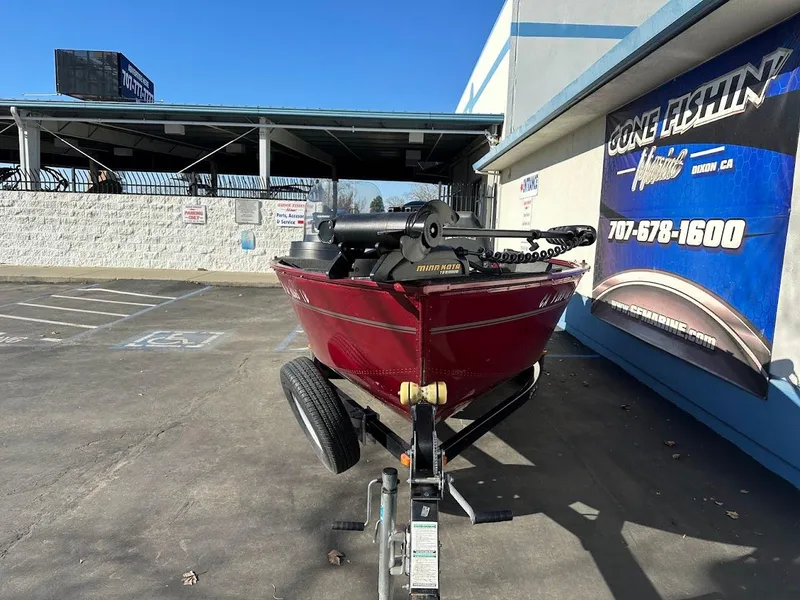 Slide: The Image of 2015 Lund 1750 Rebel XS SS boat on trailer, parked outside a building. - 3