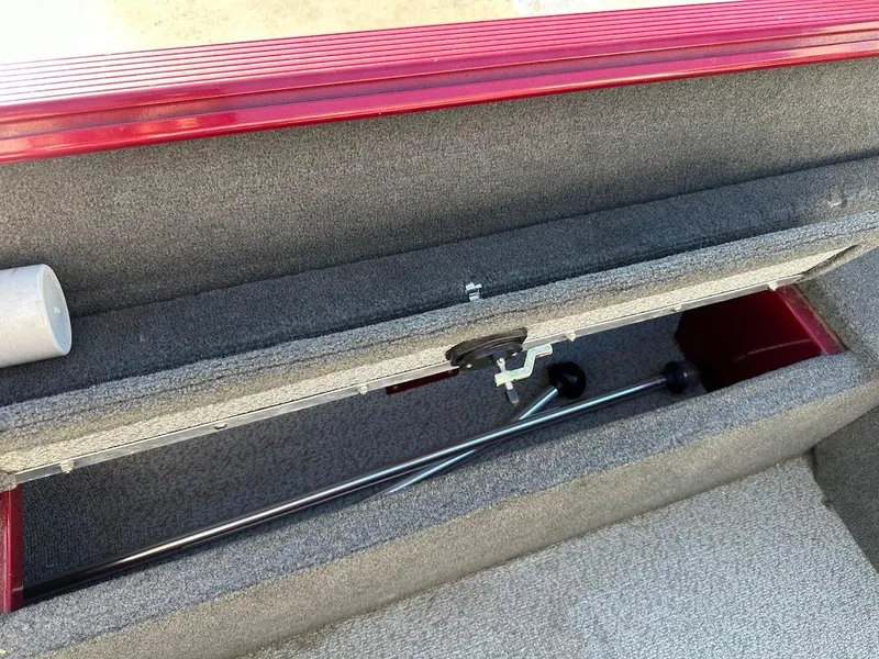 Slide: The Image of Storage compartment of 2015 Lund 1750 Rebel XS SS boat, featuring rod holders. - 33