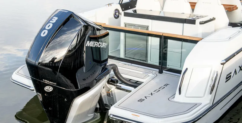 Slide: The Image of 2024 Saxdor 270 GTO boat with Mercury 300 engine, rear view on water. - 9