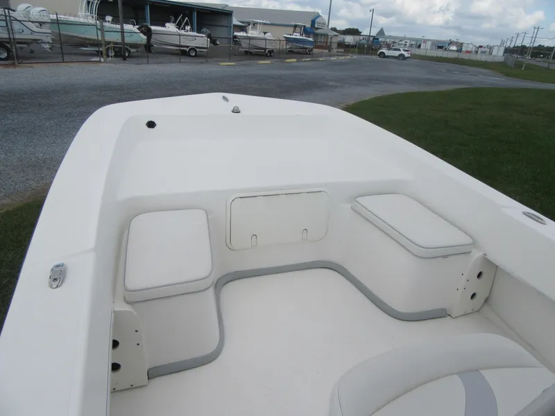 Slide: The Image of 2013 Sundance B20CCR boat interior with seating and storage compartments. - 5