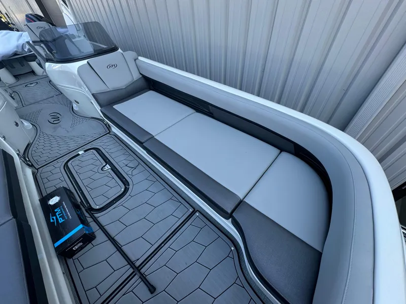 Slide: The Image of 2024 Manitou 27 XT RFXW boat interior with sleek seating and modern design. - 20