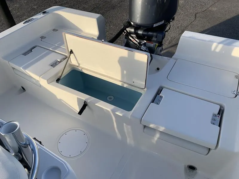 Slide: The Image of 2025 Bulls Bay 2200 XS boat interior with open storage compartments. - 10