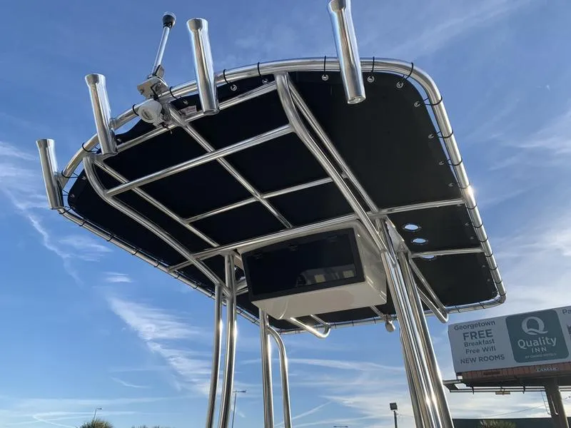 Slide: The Image of 2025 Bulls Bay 2200 XS boat T-top against a clear blue sky. - 14