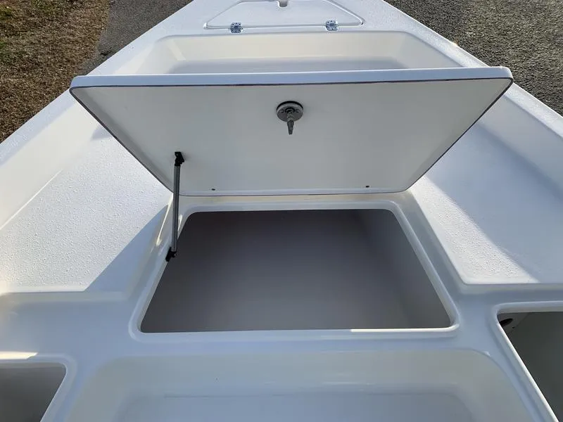 Slide: The Image of Bulls Bay 2200 XS 2025 boat storage compartment open, showcasing spacious interior. - 23