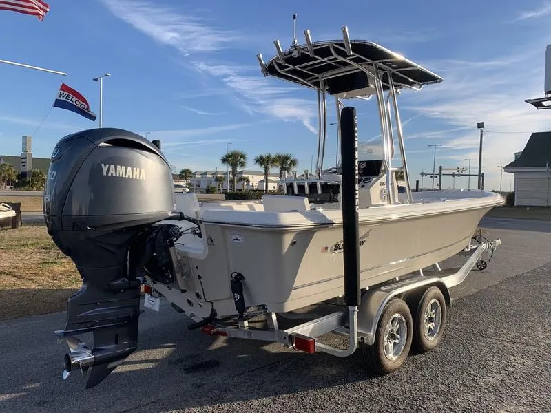 Slide: The Image of 2025 Bulls Bay 2200 XS boat on trailer with Yamaha outboard motor, parked outdoors. - 4