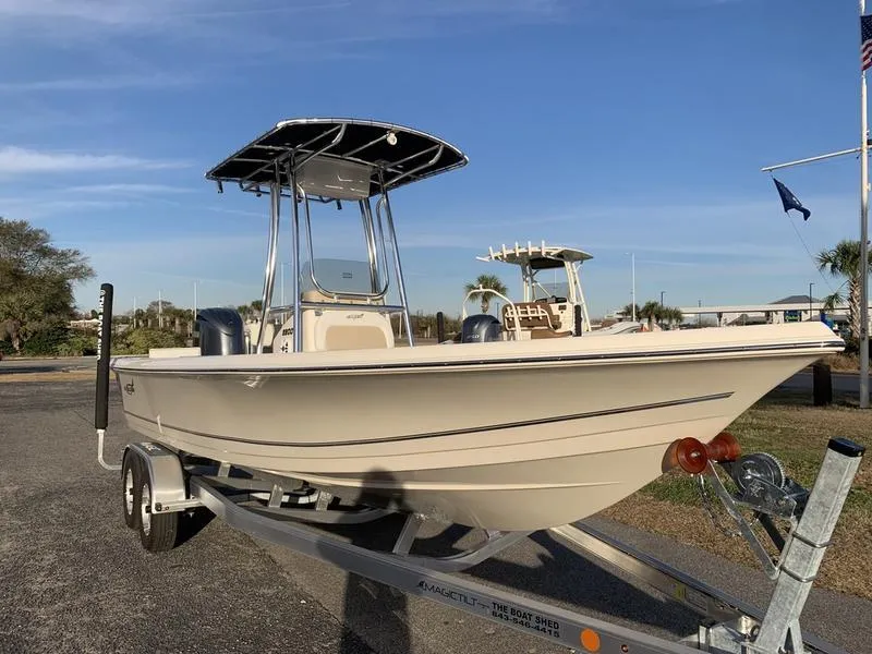 Slide: The Image of 2025 Bulls Bay 2200 XS boat on trailer under clear blue sky. - 6