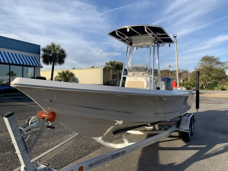 Slide: The Image of 2025 Bulls Bay 2200 XS boat on trailer, parked outdoors under clear sky. - 8