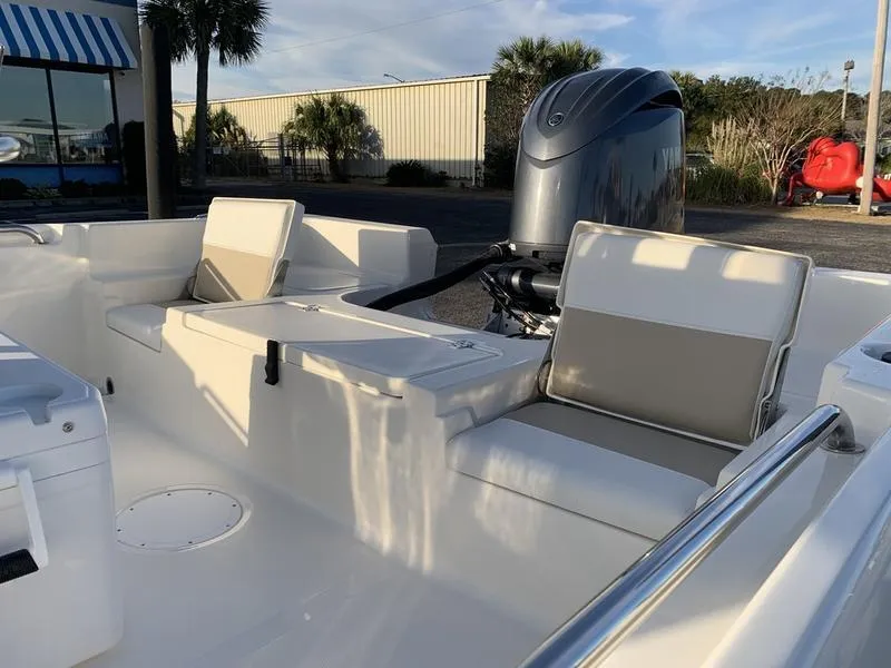 Slide: The Image of 2025 Bulls Bay 2200 XS boat interior with seating and outboard motor. - 9
