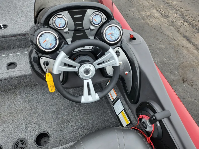 Slide: The Image of 2019 Tracker Pro Team 190 TX Tournament Edition boat dashboard with steering wheel and gauges. - 11